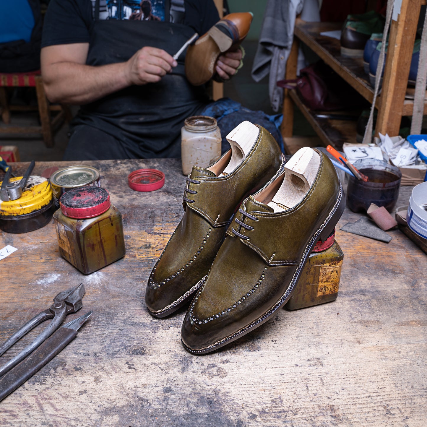 Three eyelet Derby with brogued apron in antique olive green crust calf leather