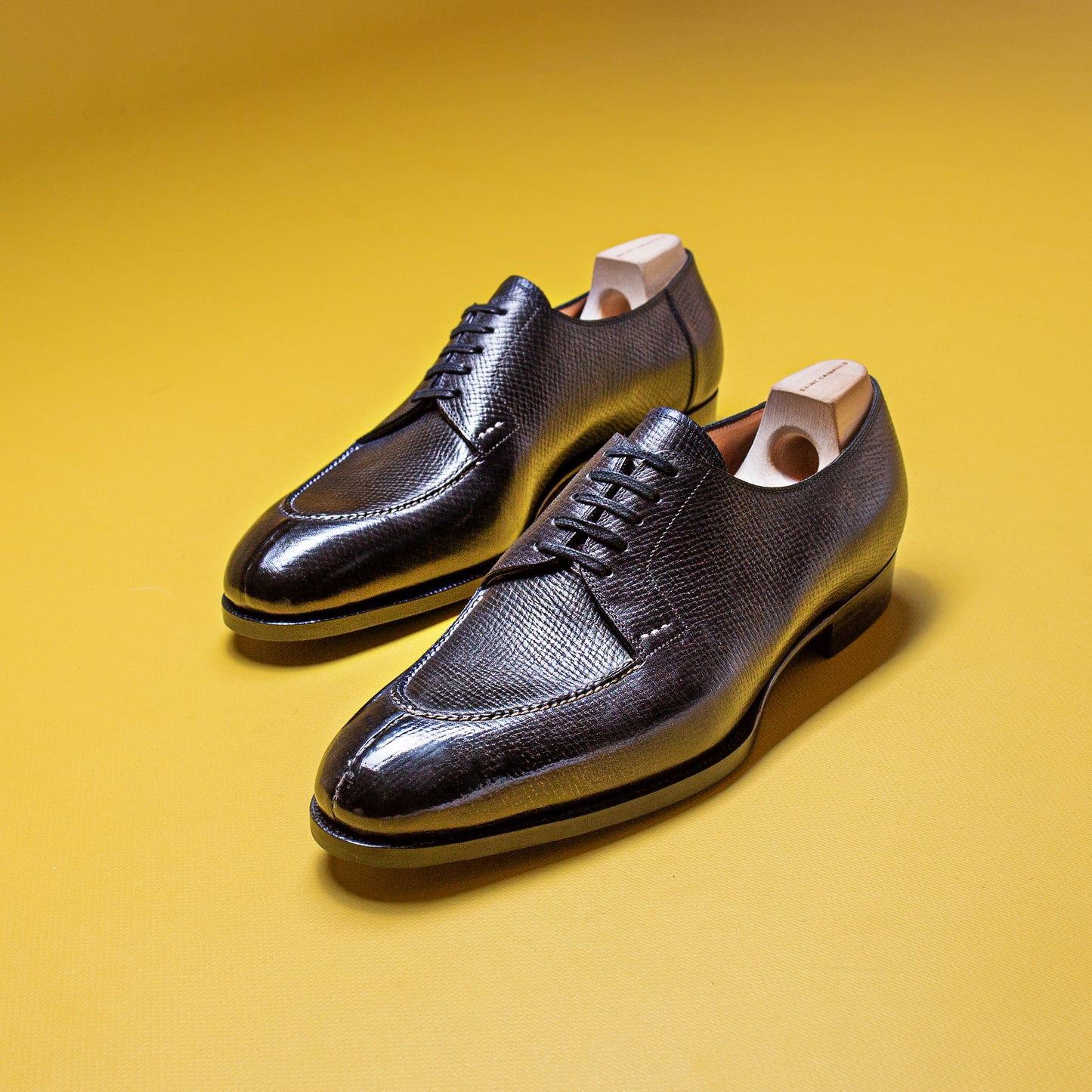 Five eyelet split toe Derby with hand-stitched apron in black Russian calf leather