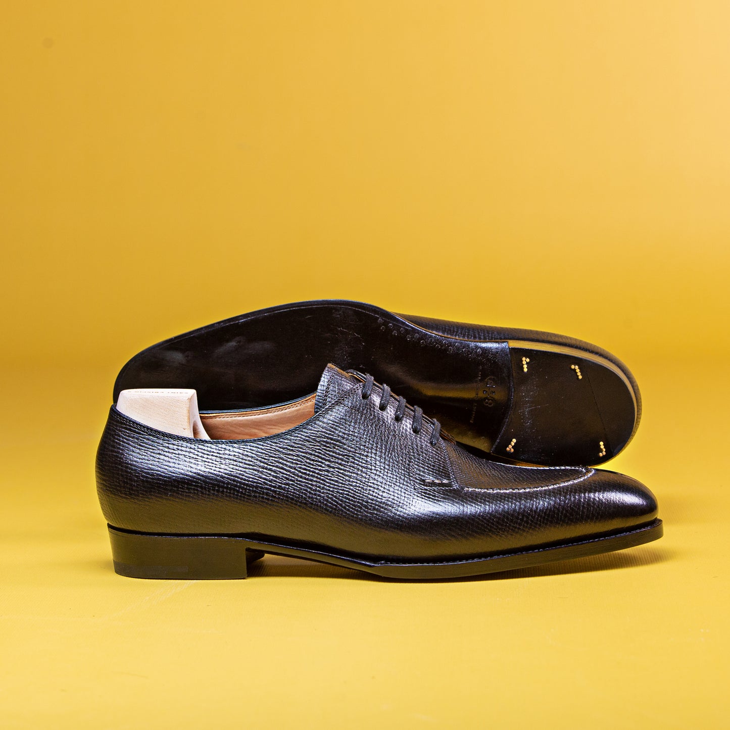 Five eyelet split toe Derby with hand-stitched apron in black Russian calf leather
