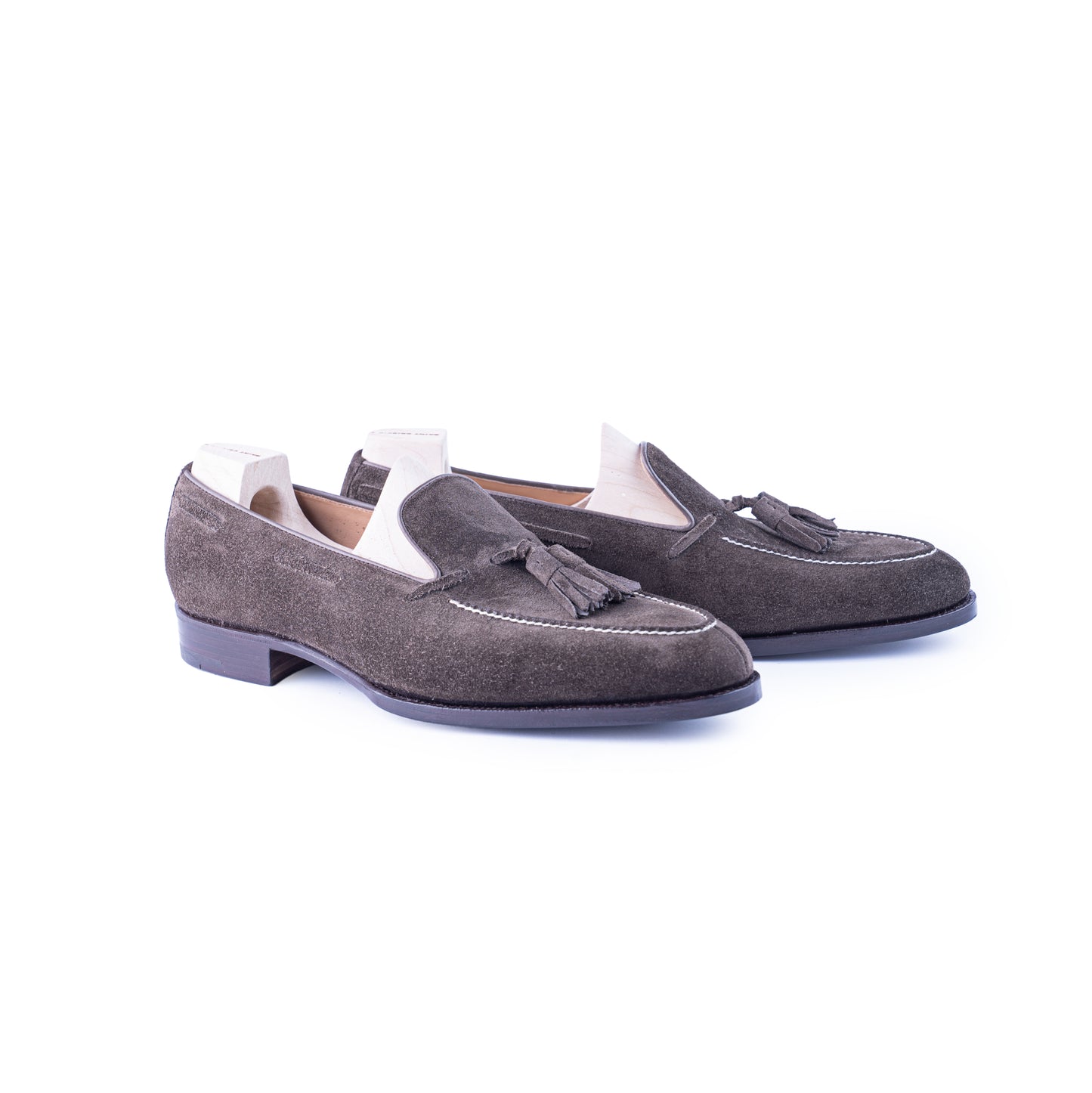 Loafer with hand stitched apron and tassels