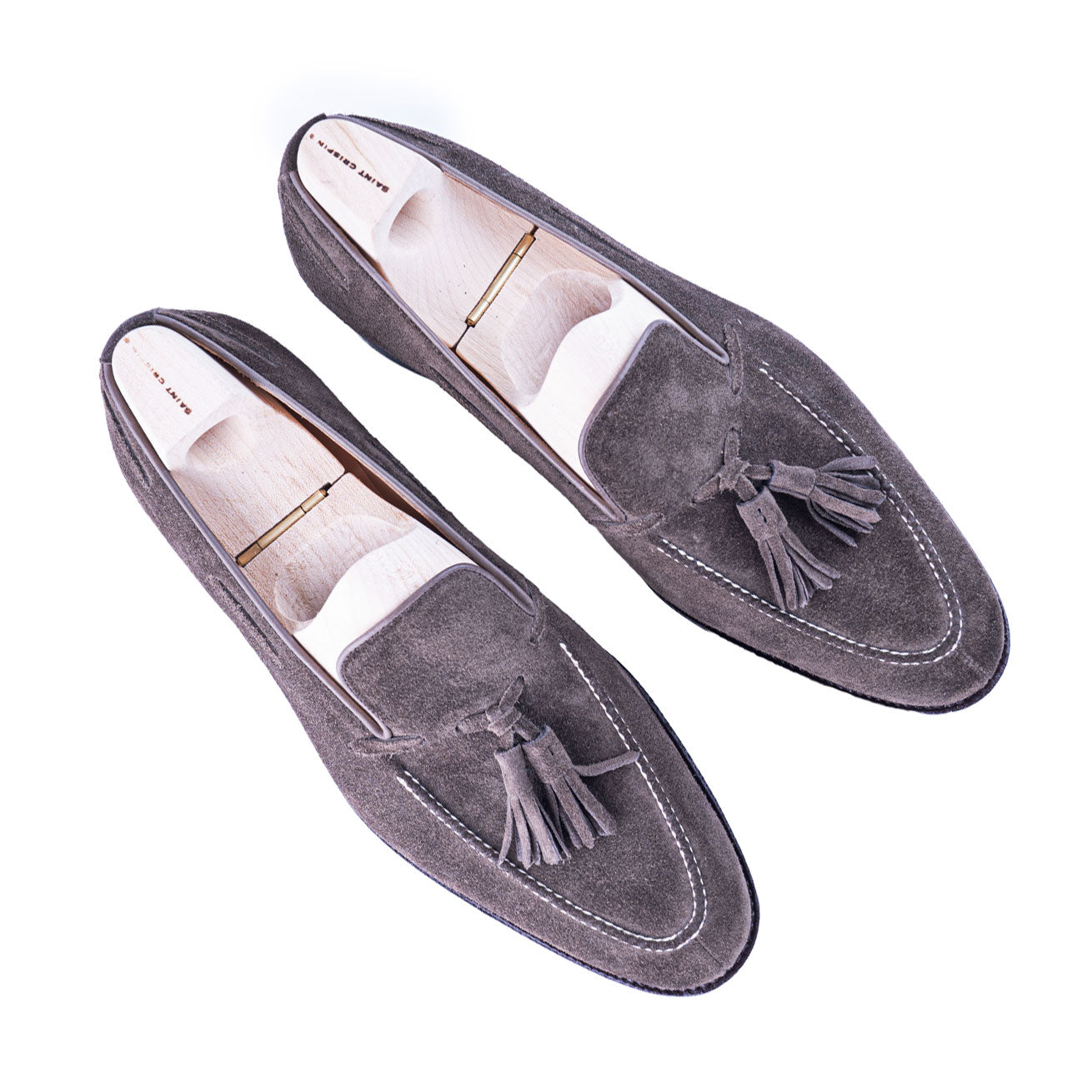 Loafer with hand stitched apron and tassels