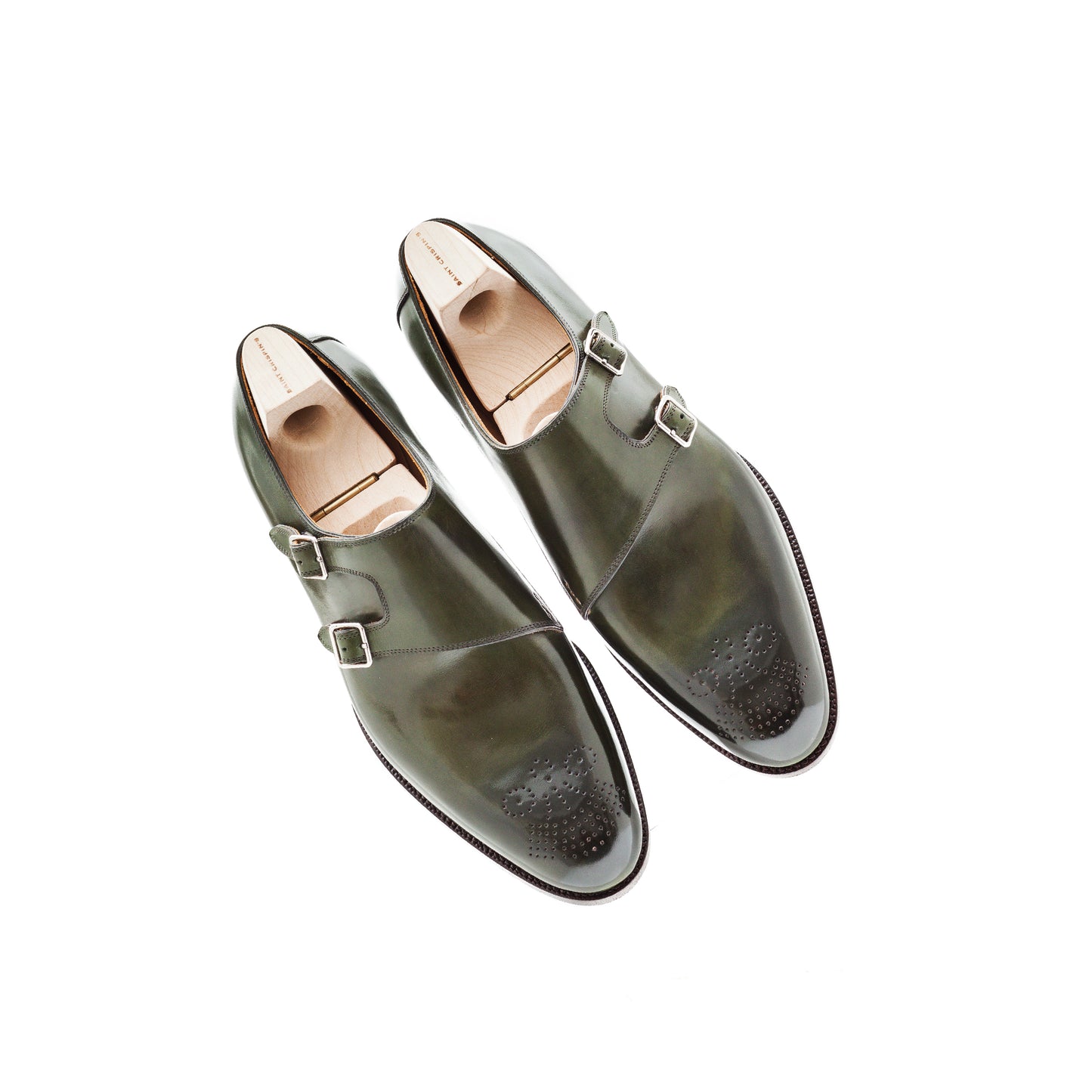 Double buckle monk with parallel straps and medallion