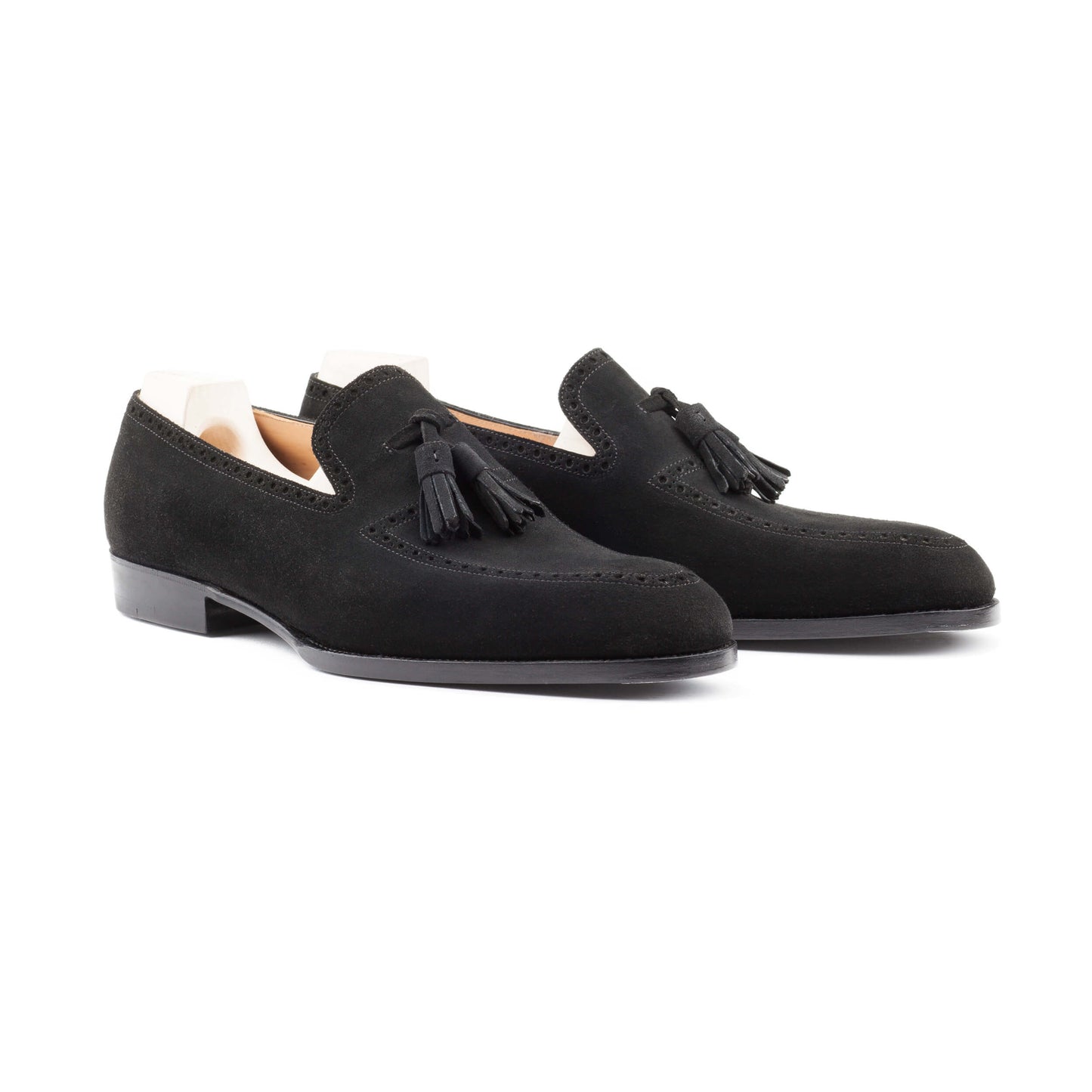 Slip-on, apron and top line brogueing with tassels