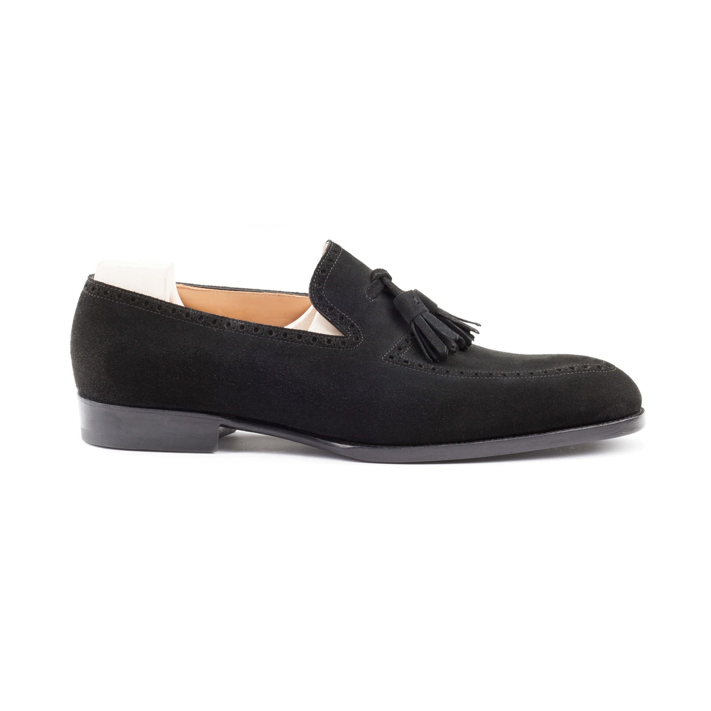 Slip-on, apron and top line brogueing with tassels