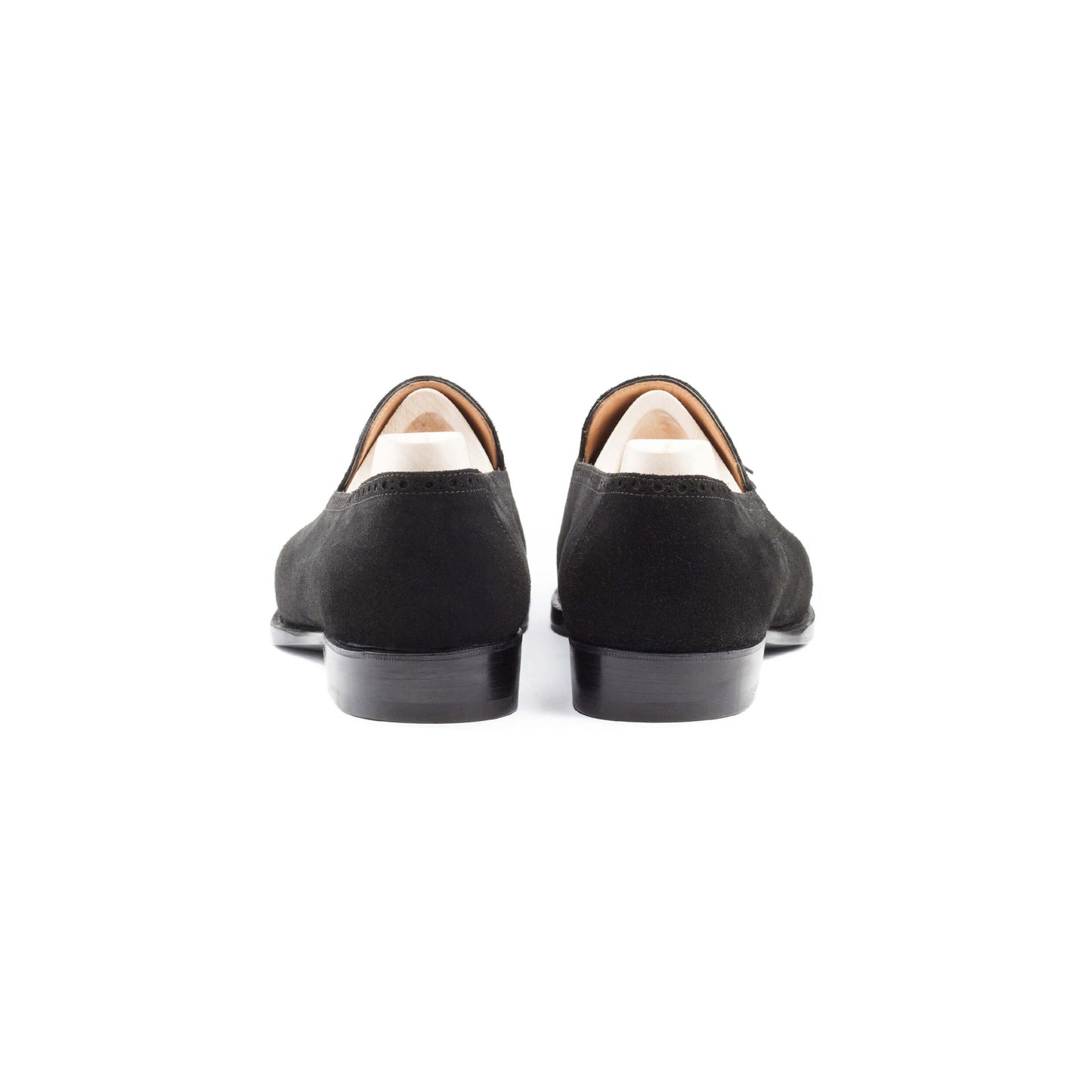 Slip-on, apron and top line brogueing with tassels