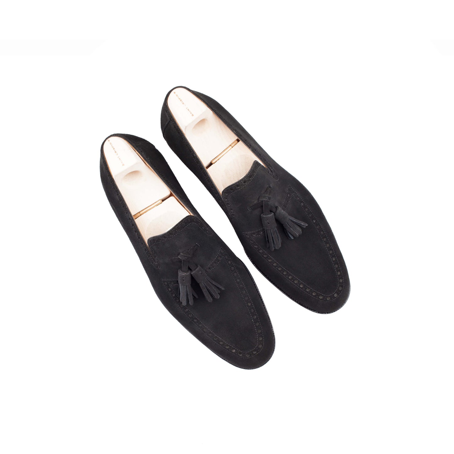 Slip-on, apron and top line brogueing with tassels