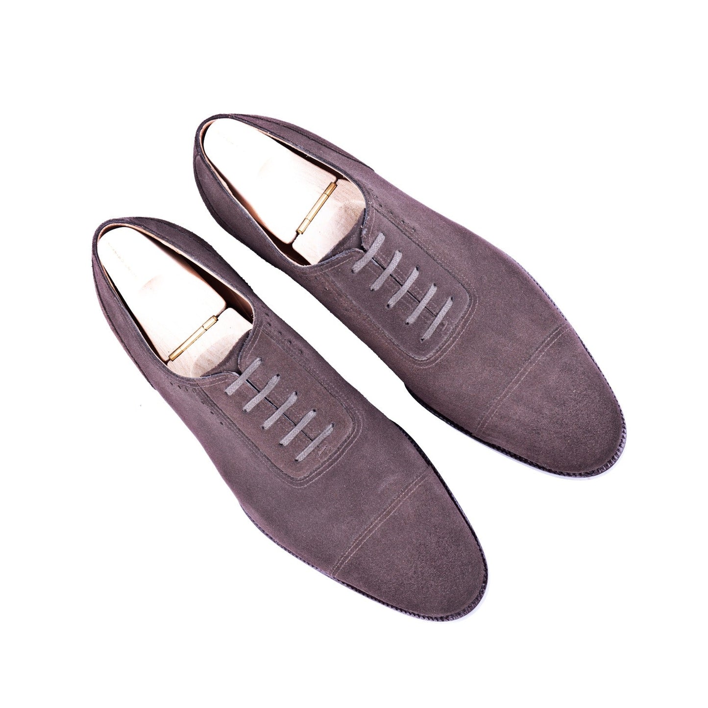 Oxford, plain sewn, straight toe box and sparingly perforated vamp