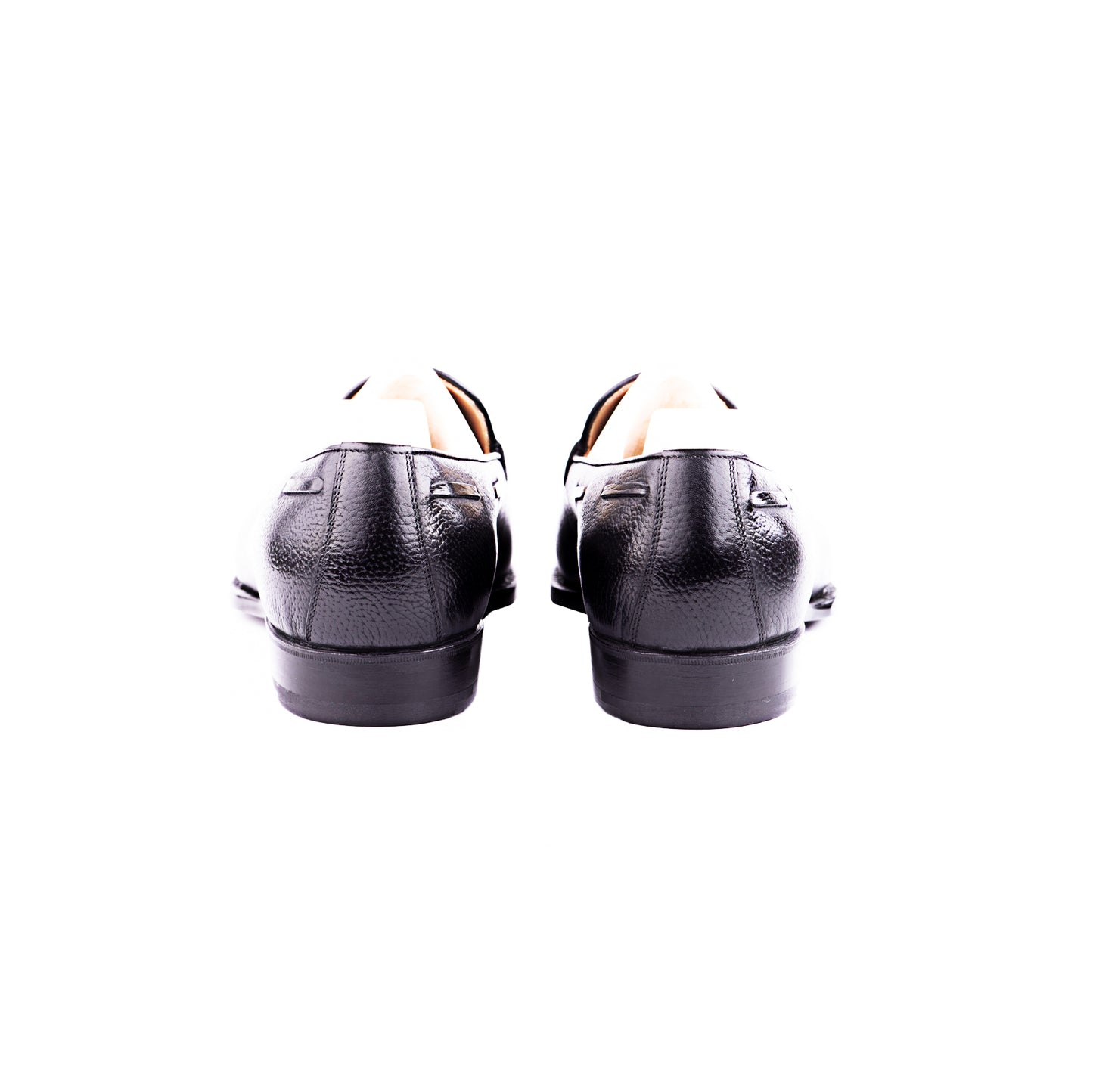 Loafer with hand stitched apron and tassels, short vamp