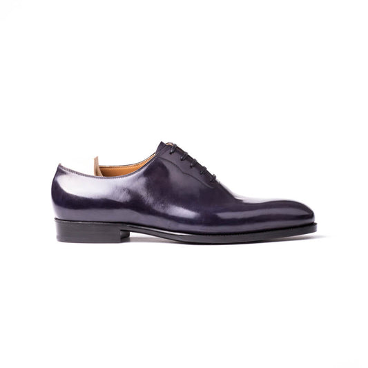 Wholecut Oxford with stitching around the laces in dark purple Crust calf