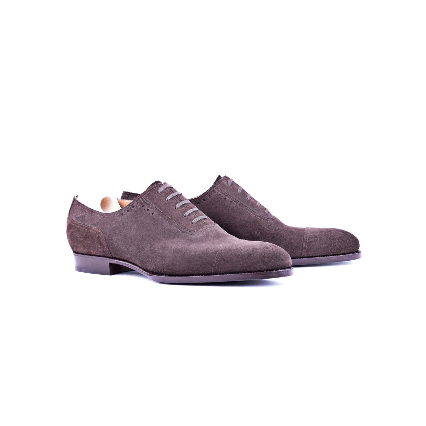 Oxford, plain sewn, straight toe box and sparingly perforated vamp